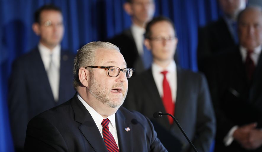 In this file photo, Brian Benczkowski, Assistant Attorney General of the Criminal Division, speaks beside members of Appalachian Regional Prescription Opioid Strike Force, during a news conference, Wednesday, April 17, 2019, in Cincinnati.  (AP Photo/John Minchillo) **FILE**