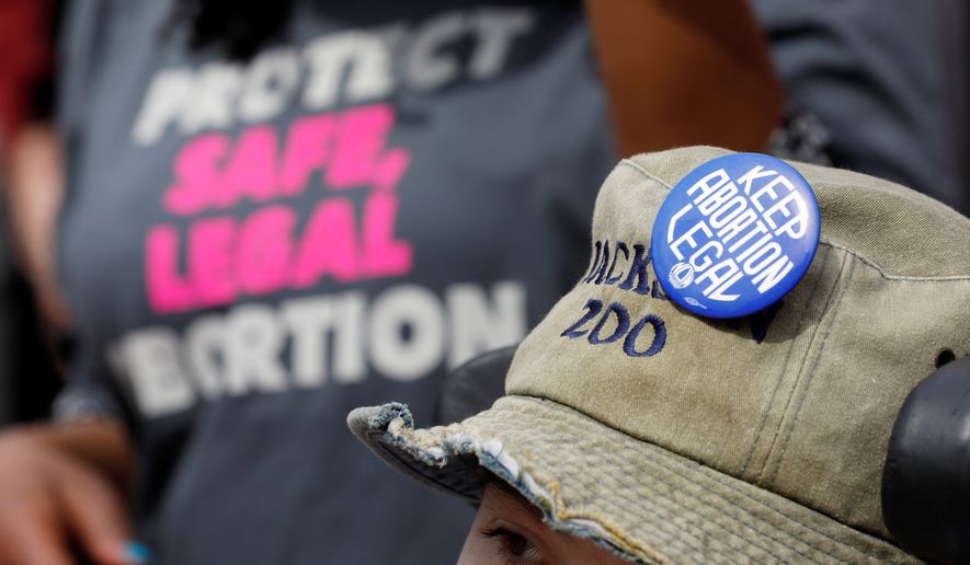 Pro-choice advocates asked the high court to strike down a law that mandates that clinics have admitting privileges to hospitals should complications from an abortion arise. (Associated Press)