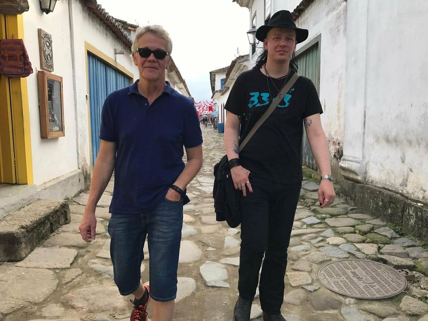 This photo courtesy of Dag Gustafsson, taken by his wife Görel Bini Gustafsson, shows Dag with his son Ola Bini in Paraty, Brazil on May 28, 2017. Bini, a privacy activist who was detained in Ecuador shortly after Julian Assange was arrested in London, said in a statement provided by his attorney that he's being held under "the best of circumstances" but that prison conditions are "despicable." Ecuadorian President Lenin Moreno claims Bini hacked cellphones and online accounts belonging to private citizens and Ecuador's government. (Dag Gustafsson via AP)