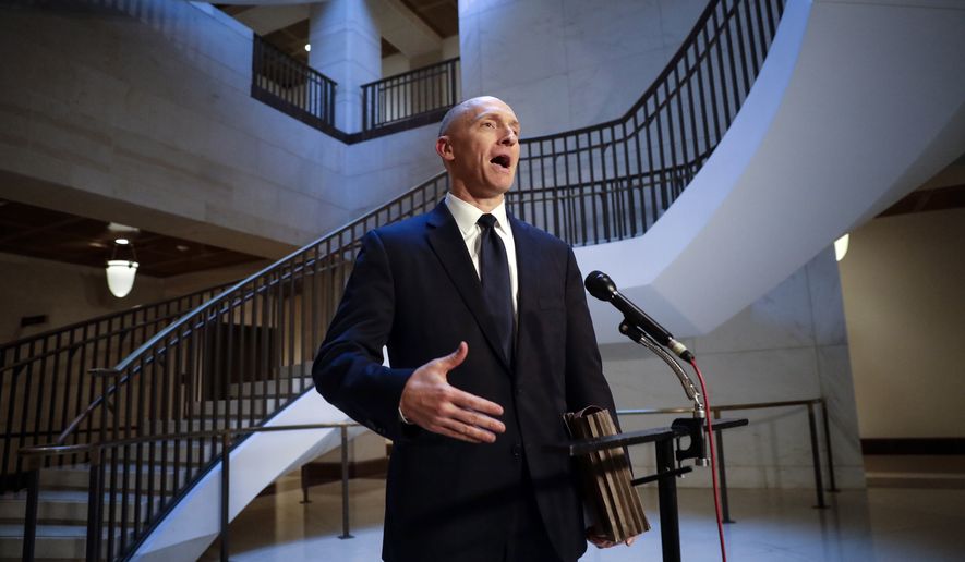 In a Nov. 2, 2017, file photo, Carter Page, a foreign policy adviser to Donald Trump&#39;s 2016 presidential campaign, speaks with reporters following a day of questions from the House Intelligence Committee, on Capitol Hill in Washington. (AP Photo/J. Scott Applewhite, File)  **FILE**