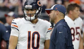 FILE - In this Sept. 23, 2018, file photo, Chicago Bears quarterback Mitchell Trubisky (10) talks with Bears head coach Matt Nagy, right, prior to an NFL football game against the Arizona Cardinals in Glendale, Ariz. The Bears are eyeing the draft from a different perch. A worst-to-first jump last season left them staring down at the rest of the NFC North, armed and loaded with one of the league’s best defenses and banking on a more creative offense led by Trubisky to improve in Nagy’s second season. (AP Photo/Rick Scuteri, File)