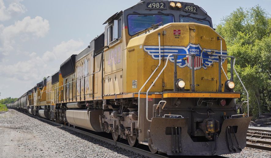 FILE- In this July 31, 2018, file photo a Union Pacific train travels through Union, Neb. Union Pacific Corp. reports earnings Thursday, April 18, 2019. (AP Photo/Nati Harnik, File)