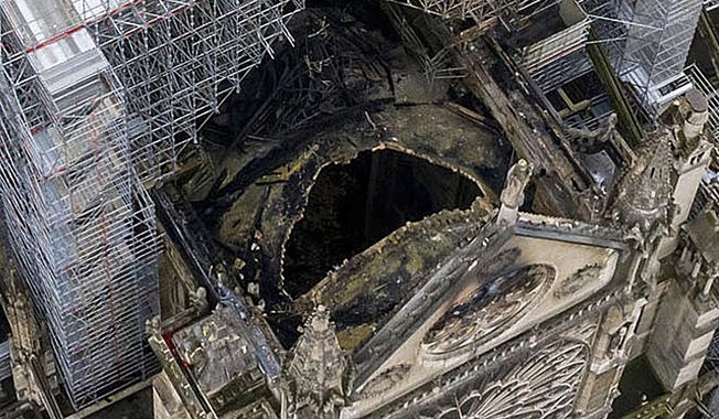 An image made available by Gigarama.ru on Wednesday April 17, 2019 shows an aerial shot of the fire damage to Notre Dame cathedral in Paris on Tuesday April 16. Nearly $1 billion has already poured in from ordinary worshippers and high-powered magnates around the world to restore Notre Dame Cathedral in Paris after it was damaged in a massive fire on Monday. (Gigarama.ru via AP)