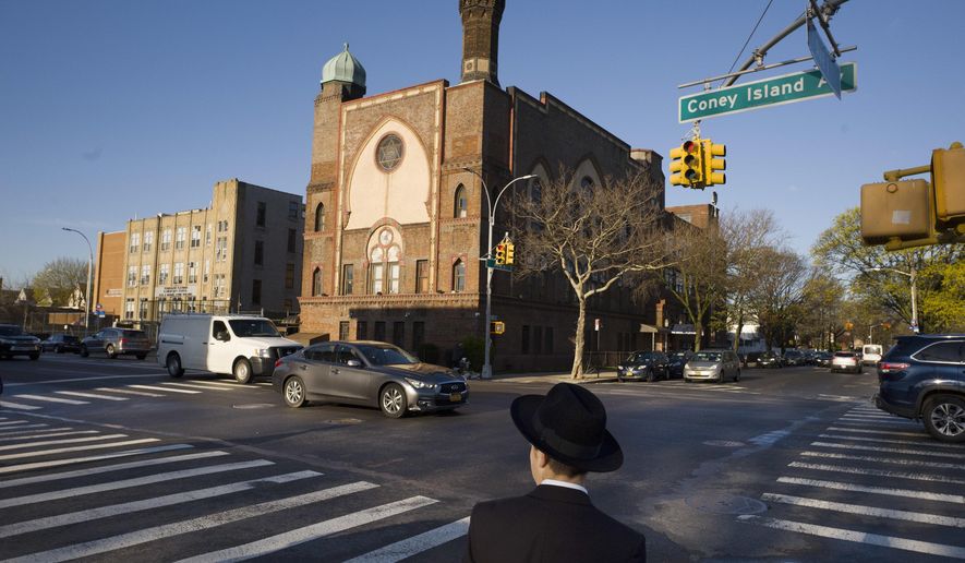 In this April 26, 2018 file photo, a Jewish boy walks to a yeshiva in the Brooklyn borough of New York. On Thursday, April 18, 2019, a judge has struck down New York State Education Department guidelines for ensuring that private schools including religious schools provide instruction that&#x27;s substantially equivalent to what public schools provide. The ruling by a state supreme court judge in Albany, N.Y., nullifies guidelines intended to ensure that ultra-Orthodox yeshivas teach secular subjects like English and math. (AP Photo/Mark Lennihan, File)