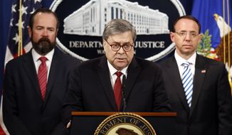 Attorney General William Barr speaks alongside Deputy Attorney General Rod Rosenstein, right, and acting Principal Associate Deputy Attorney General Edward O&#39;Callaghan, left, about the release of a redacted version of special counsel Robert Mueller&#39;s report during a news conference, Thursday, April 18, 2019, at the Department of Justice in Washington. (AP Photo/Patrick Semansky)