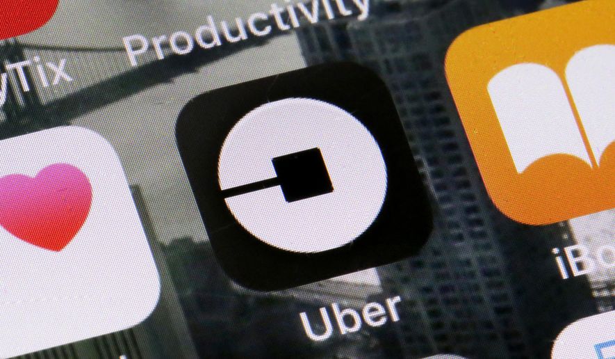FILE - This Tuesday, June 12, 2018, file photo shows the Uber app on a phone in New York. Uber on Thursday, April 18, 2019, said that it is releasing a new feature to help riders ensure they’re getting into the right vehicles. The development comes several weeks after a University of South Carolina student was killed after getting into a car she had mistaken for the Uber ride she hailed. (AP Photo/Richard Drew, File)