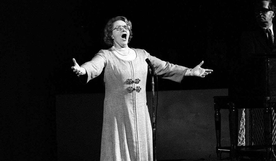 FILE - In this May 13, 1975, file photo, Kate Smith sings &amp;quot;God Bless America&amp;quot; before an NHL hockey Stanley Cup playoff game between the New York Islanders and the Philadelphia Flyers in Philadelphia. The New York Yankees have suspended the use of Smith&#39;s recording of &amp;quot;God Bless America&amp;quot; during the seventh-inning stretch while they investigate an allegation of racism against the singer. (AP Photo, File)