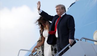 President Donald Trump and first lady Melania Trump walk down the stairs of Air Force One during their arrival at Palm Beach International Airport, Thursday, April 18, 2019, in West Palm Beach, Fla. Trump is spending the Easter weekend as his Mar-a-Lago estate. (AP Photo/Pablo Martinez Monsivais)