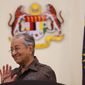 Malaysian Prime Minister Mahathir Mohamad gestures during a press conference in Putrajaya, Malaysia, Monday, April 15, 2019. Malaysia&#39;s government decided to resume a China-backed rail link project, after the Chinese contractor agreed to cut the construction cost by one-third. (AP Photo/Vincent Thian)