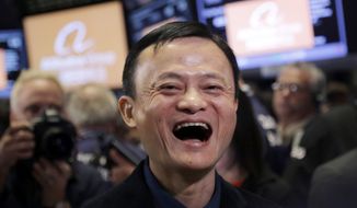 FILE - In this Sept. 19, 2014, file photo, Jack Ma, founder of Alibaba, smiles during the company&#39;s IPO at the New York Stock Exchange in New York. Remarks by Ma, one of China&#39;s richest men, that young people should work 12-hour days, six days a week if they want financial success have prompted a public debate over work-life balance in the country. (AP Photo/Mark Lennihan, File)