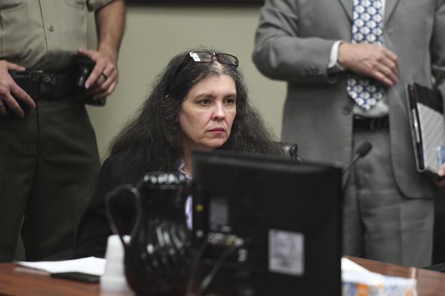 Louise Turpin sits in a courtroom during a sentencing hearing Friday, April 19, 2019, in Riverside, Calif. Turpin and her husband, David, who pleaded guilty to years of torture and abuse of 12 of their 13 children have been sentenced to life in prison with possibility of parole after 25 years. (Will Lester/The Orange County Register via AP, Pool)