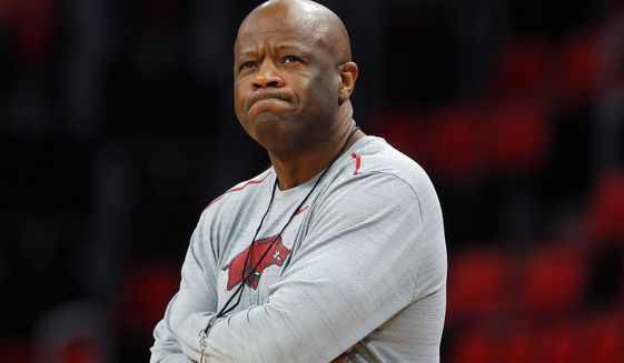 FILE - In this March 15, 2018, file photo, Arkansas head coach Mike Anderson watches practice at the NCAA college basketball tournament in Detroit. Anderson was hired as St. John&#x27;s coach on Friday, April 19, 2019, after he was fired by Arkansas last month. He also had head coaching stints at Missouri and UAB before leading the Razorbacks to five postseason appearances and a 169-102 record in eight seasons. (AP Photo/Paul Sancya, File)
