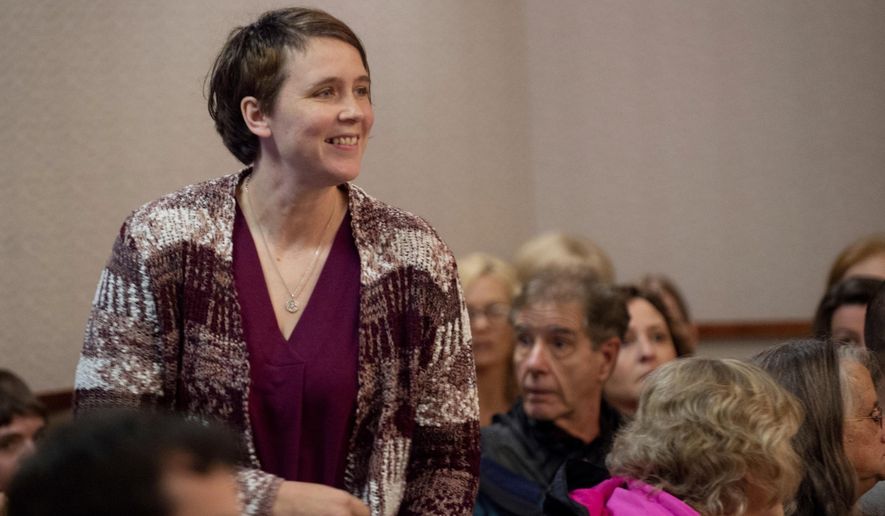Tiffany Kosakowski appears before Judge Curt Benson at the Kent County Courthouse on Thursday, April 18, 2019 in Grand Rapids, Mich. Kosakowski pleaded guilty to reckless driving for running over her 9-year-old son while dropping him off at school and has been ordered to serve 30 days in jail. Benson sentenced her Thursday to 6 months in jail, with all but 30 days suspended. He called her actions "simply inexcusable." (Neil Blake/The Grand Rapids Press via AP)