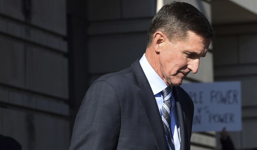 In this Dec. 1, 2017, photo, former Trump national security adviser Michael Flynn leaves federal court in Washington. (AP Photo/Susan Walsh) **FILE**