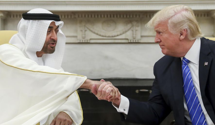 In this May 15, 2017, file photo, President Donald Trump shakes hands with Abu Dhabi&#39;s crown prince, Sheikh Mohammed bin Zayed Al Nahyan, in the White House in Washington. (AP Photo/Andrew Harnik, File)