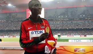 FILE - In this file photo dated Sunday, Aug. 30, 2015, Kenya&#x27;s Asbel Kiprop shows his gold medal after winning the men&#x27;s 1500m final at the World Athletics Championships at the Bird&#x27;s Nest stadium in Beijing, Sunday, Aug. 30, 2015. Former Olympic and three-time world champion Asbel Kiprop of Kenya was banned for four years Saturday for testing positive for the blood-boosting drug EPO after his claim that urine samples might have been tampered with by disreputable doping control officers was rejected. (AP Photo/Ng Han Guan, FILE)