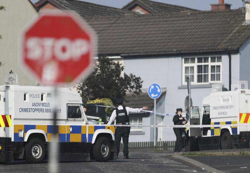 The scene in Londonderry, Northern Ireland, Friday April 19, 2019, following the death of 29-year-old journalist Lyra McKee who was shot and killed during overnight rioting. Police in Northern Ireland said Friday the dissident republican group the New IRA was probably responsible for the fatal shooting of a journalist during overnight rioting in the city of Londonderry. (Brian Lawless/PA via AP)