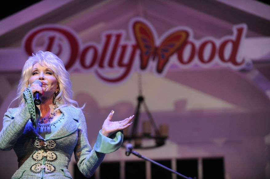 FILE - In this Aug. 21, 2013 file photo, Dolly Parton speaks during a news conference in Pigeon Forge, Tenn. Dolly Parton's Dollywood has welcomed a fluffy addition to the amusement park — an eaglet. Media outlets report the eaglet hatched Wednesday, April 17, 2019. A social media post by the park says "welcome to the world, little eaglet!" The Tennessee park says it's "so excited for this addition to the family." (Amy Smotherman Burgess/Knoxville News Sentinel via AP)