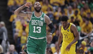 Boston Celtics forward Marcus Morris (13) celebrates during the second half of Game 4 against the Indiana Pacers in the NBA basketball first-round playoff series in Indianapolis, Sunday, April 21, 2019. The Celtics defeated the Pacers 110-106 to win the series 4-0. (AP Photo/Michael Conroy)