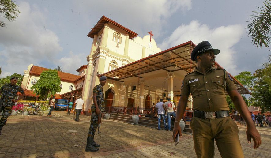 Sri Lankan army soldiers secure the area around St. Sebastian&#39;s Church damaged in blast in Negombo, north of Colombo, Sri Lanka, Sunday, April 21, 2019.  More than hundred were killed and hundreds more hospitalized with injuries from eight blasts that rocked churches and hotels in and just outside of Sri Lanka&#39;s capital on Easter Sunday, officials said, the worst violence to hit the South Asian country since its civil war ended a decade ago. (AP Photo/Chamila Karunarathne)