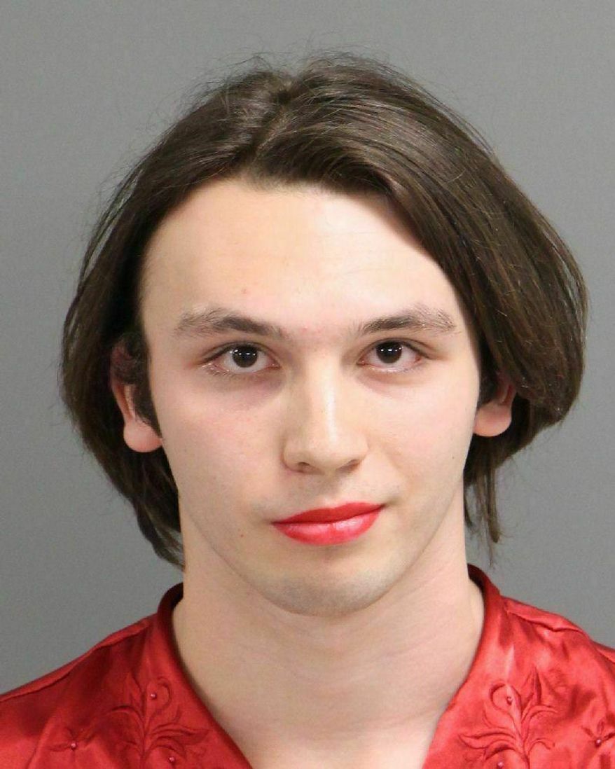 This undated photo provided by Raleigh/Wake City-County Bureau of Identification shows Enzo Niebuhr who was arrested Sunday April 21, 2019, on charges that he and another person defaced a Confederate monument in Raleigh, N.C. (Raleigh/Wake City-County Bureau of Identification via AP)