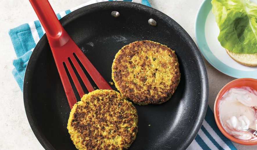 This undated photo provided by America's Test Kitchen in April 2019 shows Crispy Veggie Burgers in Brookline, Mass. This recipe appears in the "Complete Cookbook for Young Chefs." (Steve Klise/America's Test Kitchen via AP)