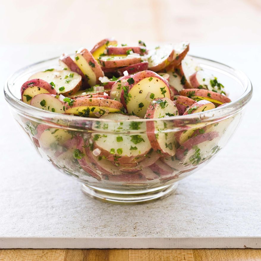 This undated photo provided by America's Test Kitchen in April 2019 shows a French Potato Salad with Dijon in Brookline, Mass. This recipe appears in the cookbook "Revolutionary Recipes." (Carl Tremblay/America's Test Kitchen via AP)