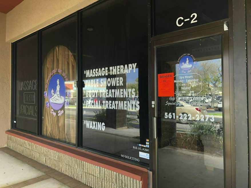 FILE- This Feb. 19, 2019, file photo, shows the Orchids of Asia Day Spa in Jupiter, Fla. Nearly three dozen men and women have filed a federal class-action lawsuit accusing Florida authorities of unlawfully videotaping them as they received legal massages at a parlor where New England Patriots owner Robert Kraft and others allegedly paid for sex. The lawsuit by 31 John and Jane Does alleges that Palm Beach County State Attorney Dave Aronberg, the Jupiter Police Department and the case's lead detective violated their rights to privacy when they were videotaped in January receiving massages at the Orchids of Asia Day Spa. The lawsuit was originally filed Friday, April 19, 2019, with 17 accusers. (Hannah Morse/Palm Beach Post via AP, File)