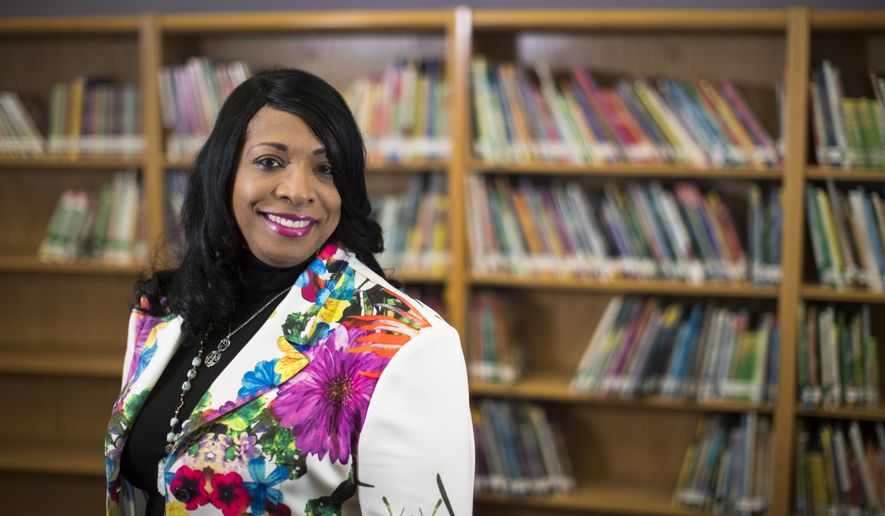 This Wednesday, April 18, 2018 photo shows Carlotta Outley Brown, who was then the principal at Peck Elementary School located in southeast Houston. Outley Brown took over as principal at James Madison High School during the current school year, becoming the school&#x27;s fourth principal in five years. Outley Brown has implemented a dress code for parents because she says it is necessary to establish high standards for students, despite criticism that the move could be discriminatory. (Marie D. De Jesus/Houston Chronicle via AP)