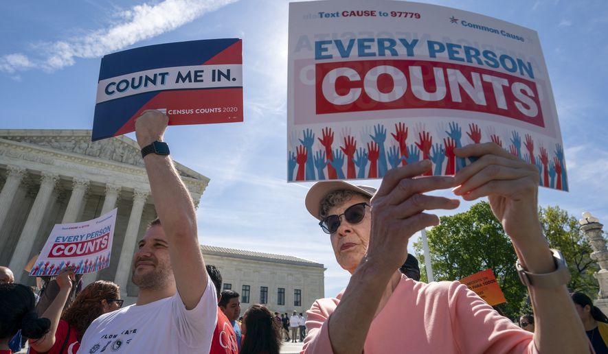 Immigration activists rally outside the Supreme Court as the justices hear arguments over the Trump administration&#39;s plan to ask about citizenship on the 2020 census, in Washington, Tuesday, April 23, 2019. Critics say the citizenship question on the census will inhibit responses from immigrant-heavy communities that are worried the information will be used to target them for possible deportation. (AP Photo/J. Scott Applewhite)