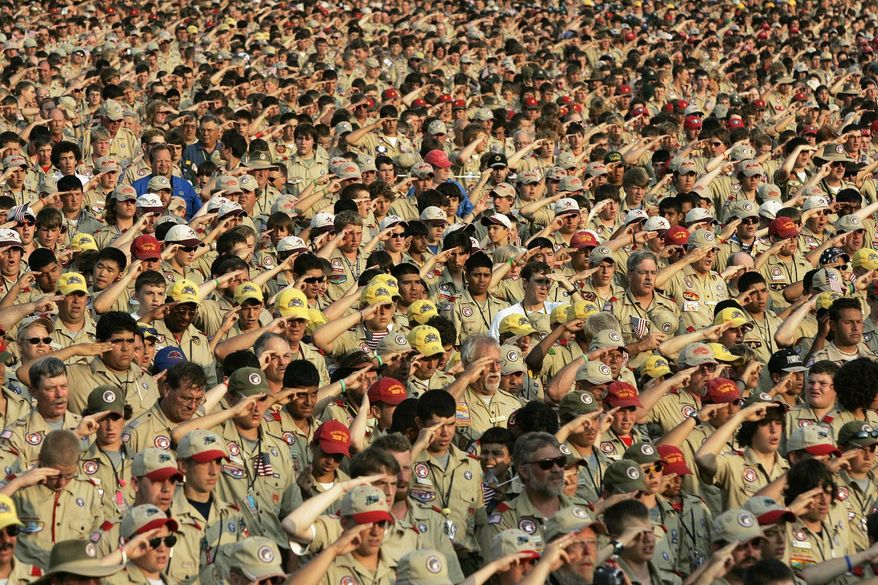 In this July 31, 2005 file photo, Boy Scouts salute as they recite the Pledge of Allegiance during the Boy Scout Jamboree in Bowling Green, Va. (AP Photo/ Haraz N. Ghanbari) **FILE**