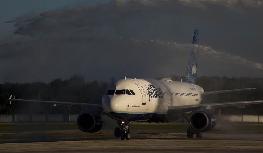 FILE - In this Nov. 10, 2018, file photo JetBlue airline inaugural flight from Boston is sprayed with a water salute after landing at the Jose Marti International Airport in Havana, Cuba. JetBlue reports financial results Tuesday, April 23, 2019. (AP Photo/Desmond Boylan, File)