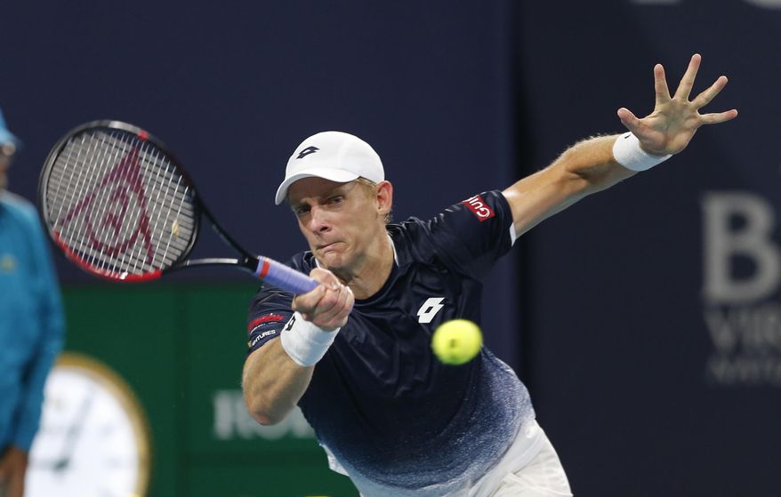 FILE - In this March 28, 2019, file photo, Kevin Anderson, of South Africa, hits a forehand to Roger Federer, of Switzerland, during a quarterfinal match at the Miami Open tennis tournament, in Miami Gardens, Fla. Two-time Grand Slam runner-up Kevin Anderson is skipping the clay-court swing this season because of a lingering right elbow injury. Anderson announced Tuesday, April 23, 2019, via a post on Twitter that he is withdrawing from the French Open, as well as tuneup tournaments in Estoril, Madrid and Rome. (AP Photo/Joe Skipper, File)