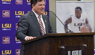 Scott Woodward answers questions after being introduced as the new Director of Athletics at LSU, Tuesday April 23, 2019, in Baton Rouge, La. Woodward, who graduated from LSU in 1985, was the Vice-Chancellor of External Affairs at his alma mater under former Chancellor Mark Emmert from 2000-2004. Woodward spent time at Washington and Texas A&amp;amp;M before accepting the job at LSU as a replacement for Joe Alleva. (Bill Feig/The Advocate via AP)