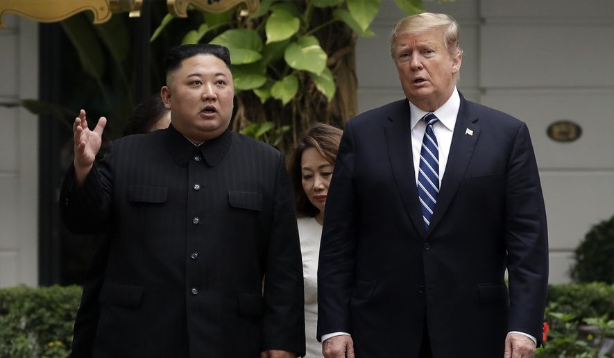 In this Feb. 28, 2019, file photo, North Korean leader Kim Jong Un, left, and U.S. President Donald Trump take a walk after their first meeting at the Sofitel Legend Metropole Hanoi hotel in Hanoi. Two months after he failed to win a badly needed easing of sanctions from Trump, Kim is traveling to Russia in a possible attempt to win its help as the U.S.-led trade sanctions hurt his country’s already-struggling economy. (AP Photo/Evan Vucci, File)