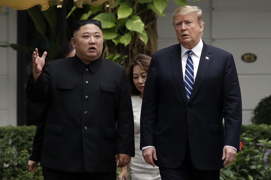 In this Feb. 28, 2019, file photo, North Korean leader Kim Jong Un, left, and U.S. President Donald Trump take a walk after their first meeting at the Sofitel Legend Metropole Hanoi hotel in Hanoi. Two months after he failed to win a badly needed easing of sanctions from Trump, Kim is traveling to Russia in a possible attempt to win its help as the U.S.-led trade sanctions hurt his country’s already-struggling economy. (AP Photo/Evan Vucci, File)