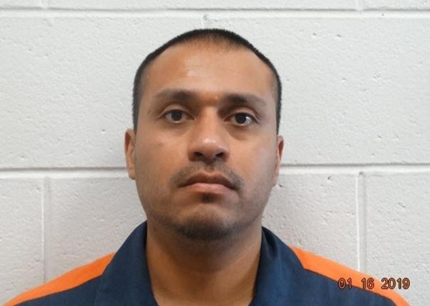 In this undated photo provided by the Michigan Department of Corrections, Juan Carlos Nunez is shown. Nunez, sentenced to life in prison for a murder committed when he was 16, has been handed the same prison term. Ottawa County Circuit Court Judge Jon Hulsing resentenced 38-year-old Nunez to life in prison without the possibility of parole Wednesday, April 24, 2019. (Michigan Department of Corrections via AP)