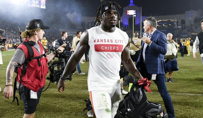 FILE - In this Nov. 19, 2018, file photo, Kansas City Chiefs wide receiver Tyreek Hill walks off the field after an NFL football game against the Los Angeles Rams, in Los Angeles. The Kansas City Chiefs have made a habit of inciting controversy during the NFL draft in the Andy Reid era by acquiring players that have a history of off-the-field issues. The team took a chance on cornerback Marcus Peters, who was traded away after getting into trouble with coaches. It drafted running back Kareem Hunt, then quickly cut him when he kicked a woman in a hotel hallway. And it picked wide receiver Tyreek Hill, who is currently dealing with a domestic violence case that centers on the 3-year-old child he shares with his fiance.(AP Photo/Kelvin Kuo, File)