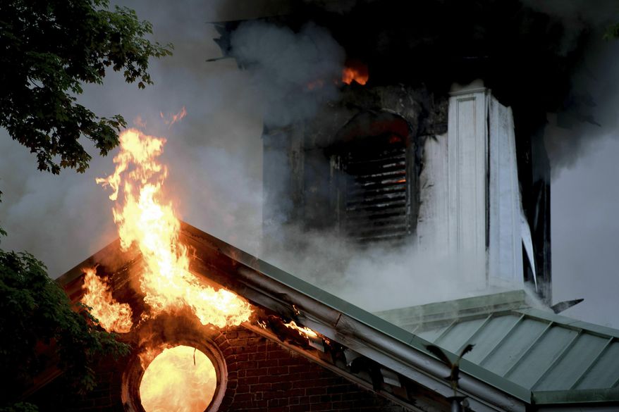 In this Tuesday, April 23, 2019, photo flames rise from a fire at the Loudon County Courthouse, one of the oldest courthouses in Tennessee, in Loudon, Tenn. The fire caused significant damage to the courthouse. (Calvin Mattheis/Knoxville News Sentinel via AP)