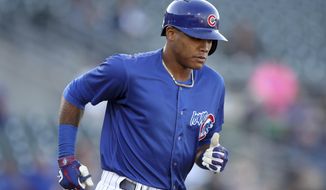 Iowa Cubs shortstop Addison Russell runs to first base during a Triple-A baseball game against the Nashville Sounds, Wednesday, April 24, 2019, in Des Moines, Iowa. Russell played in his first game of the season Wednesday for Iowa as he prepares to return to the Chicago Cubs following his domestic violence suspension. (AP Photo/Charlie Neibergall)