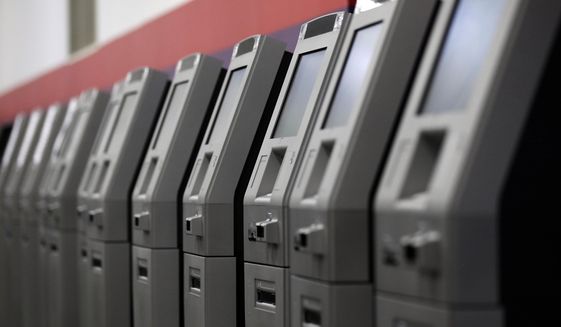 FILE - In this Aug. 30, 2017, photo, automated teller machines are lined up during the manufacturing process at Diebold Nixdorf in Greensboro, N.C. It’s important to find a bank that meets all your unique needs in terms of access, technology and cost. Be sure to consider credit unions or online banks that typically offer lower fees and better interest rates. (AP Photo/Gerry Broome, File)