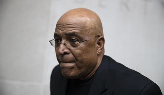 FILE - In this Aug. 1, 2017, file photo, former Reading Mayor Vaughn Spencer departs from the federal courthouse in Philadelphia. The former Pennsylvania mayor who rewarded individuals and businesses that donated to his campaign with expensive city contracts will be sentenced. (AP Photo/Matt Rourke, File)