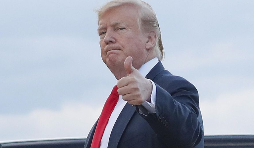 In this April 21, 2019 photo, President Donald Trump gives a &#x27;thumbs-up&#x27; as he walks across the tarmac during his arrival on Air Force One at Andrews Air Force Base, Md. (AP Photo/Pablo Martinez Monsivais)