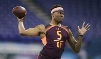 FILE - In this March 2, 2019, file photo, Ohio State quarterback Dwayne Haskins runs a drill at the NFL football scouting combine, in Indianapolis. Haskins is a possible pick in the 2019 NFL Draft. (AP Photo/Michael Conroy, File)