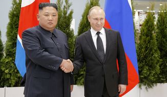 Russian President Vladimir Putin, right, and North Korea&#x27;s leader Kim Jong Un shake hands during their meeting in Vladivostok, Russia, Thursday, April 25, 2019. Putin and Kim are set to have one-on-one meeting at the Far Eastern State University on the Russky Island across a bridge from Vladivostok. The meeting will be followed by broader talks involving officials from both sides. (AP Photo/Alexander Zemlianichenko, Pool)