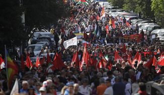 People take part in a Liberation Day march in Rome, Thursday, April 25, 2019. Italian leaders are holding observances on Liberation Day, which celebrates the end of the country’s fascist dictatorship during World War II, with appeals against glorifying dictator Benito Mussolini. (AP Photo/Alessandra Tarantino)
