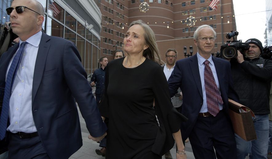 District Court Judge Shelley M. Richmond Joseph, center, departs federal court, Thursday, April 25, 2019, in Boston after facing obstruction of justice charges for allegedly helping a man in the country illegally evade immigration officials as he left her Newton, Mass., courthouse after a hearing in 2018. (AP Photo/Steven Senne) ** FILE **