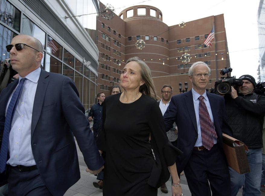 District Court Judge Shelley M. Richmond Joseph, center, departs federal court, Thursday, April 25, 2019, in Boston after facing obstruction of justice charges for allegedly helping a man in the country illegally evade immigration officials as he left her Newton, Mass., courthouse after a hearing in 2018. (AP Photo/Steven Senne)