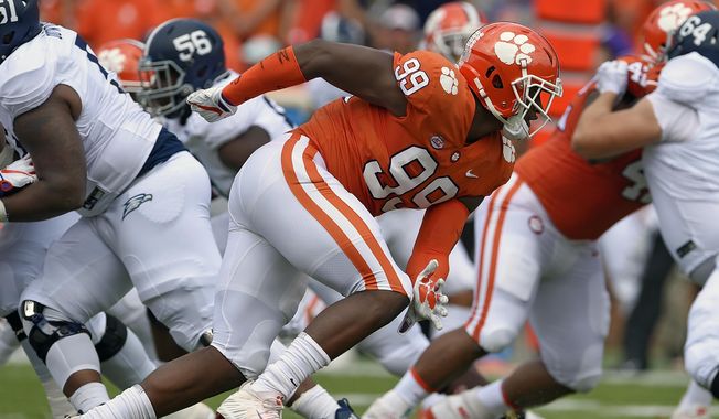 FILE - In this Sept. 15, 2018, file photo, Clemson&#x27;s Clelin Ferrell (99) rushes into the backfield during the first half of an NCAA college football game against Georgia Southern, in Clemson, S.C. Ferrell is a possible pick in the 2019 NFL Draft. (AP Photo/Richard Shiro, File)