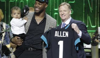 Kentucky linebacker Josh Allen poses with NFL Commissioner Roger Goodell after the Jacksonville Jaguars selected Allen in the first round at the NFL football draft, Thursday, April 25, 2019, in Nashville, Tenn. (AP Photo/Steve Helber)